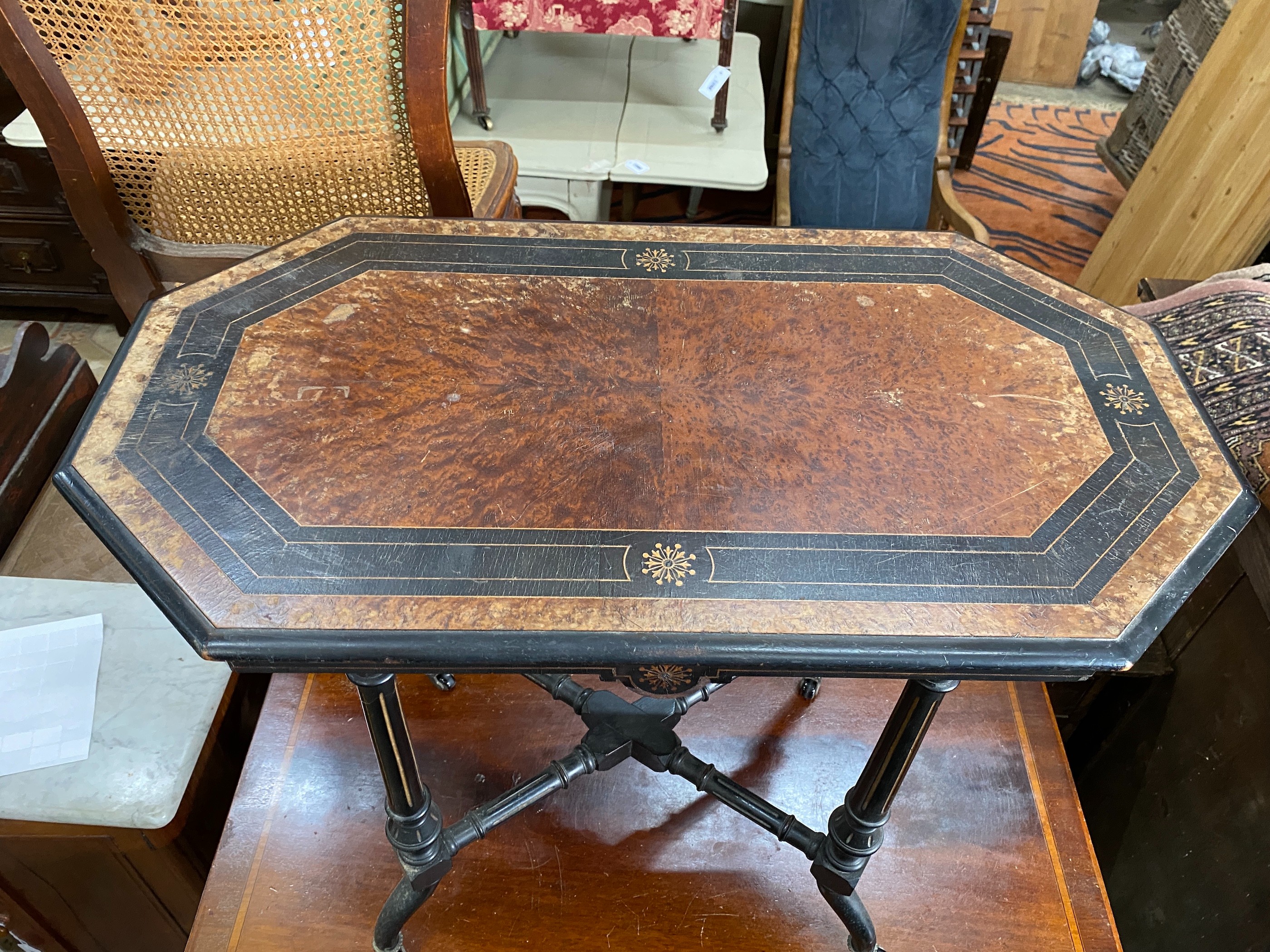 A late Victorian ebonised amboyna octagonal centre table, width 81cm, depth 46cm, height 69cm